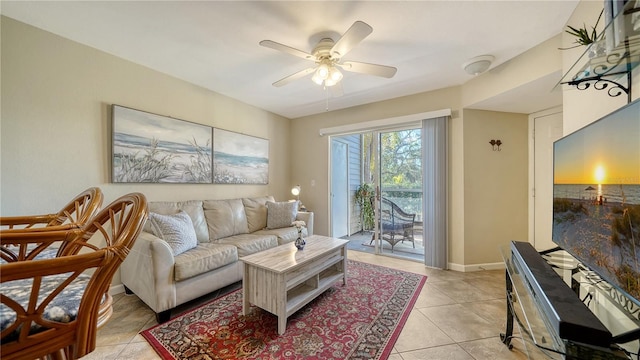 tiled living room with ceiling fan