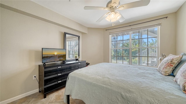 tiled bedroom with ceiling fan