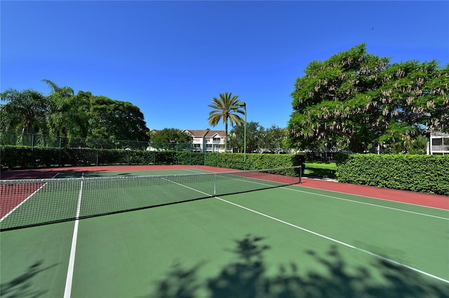 view of sport court with basketball hoop