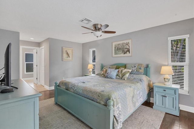 bedroom featuring ceiling fan and hardwood / wood-style flooring