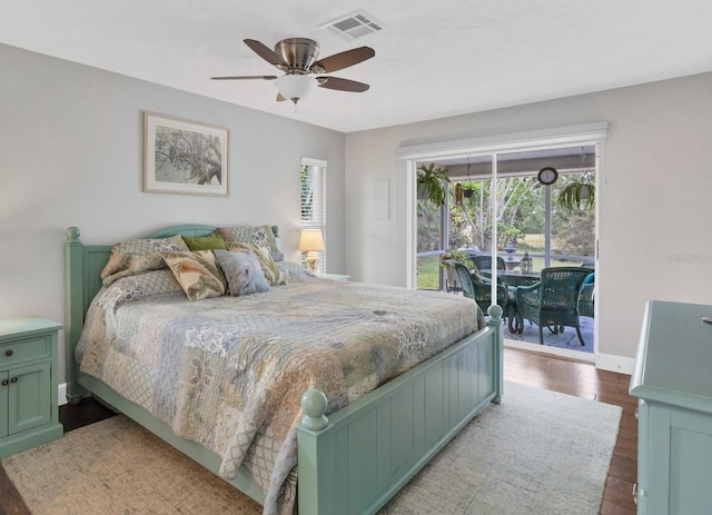 bedroom featuring ceiling fan, dark hardwood / wood-style floors, and access to outside