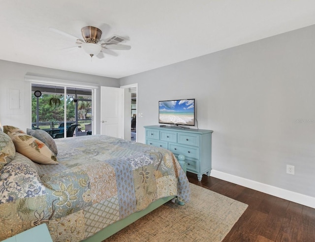 bedroom with ceiling fan, access to exterior, dark hardwood / wood-style flooring, and a walk in closet