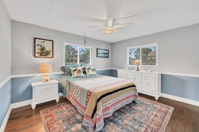 bedroom with ceiling fan and dark hardwood / wood-style flooring