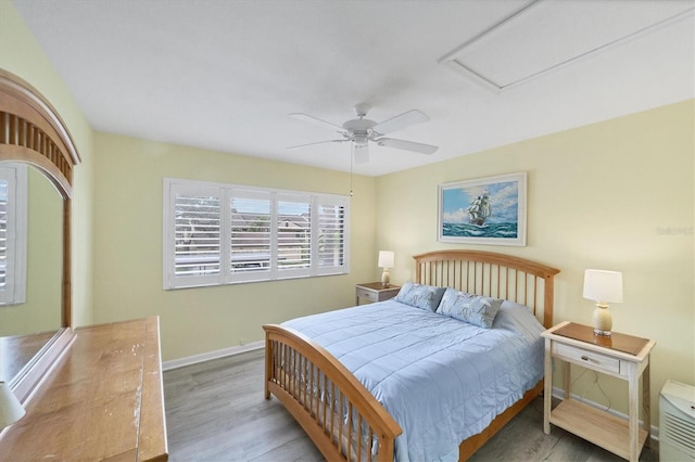 bedroom featuring ceiling fan and hardwood / wood-style flooring