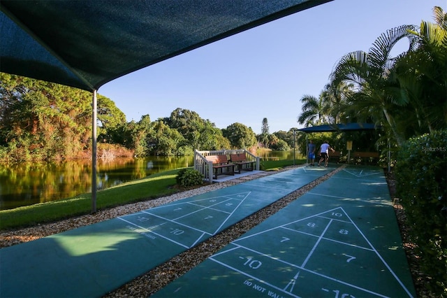 surrounding community featuring a water view