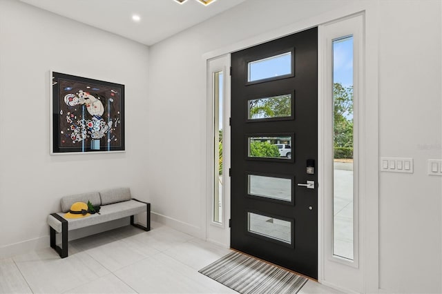 entrance foyer with light tile patterned floors