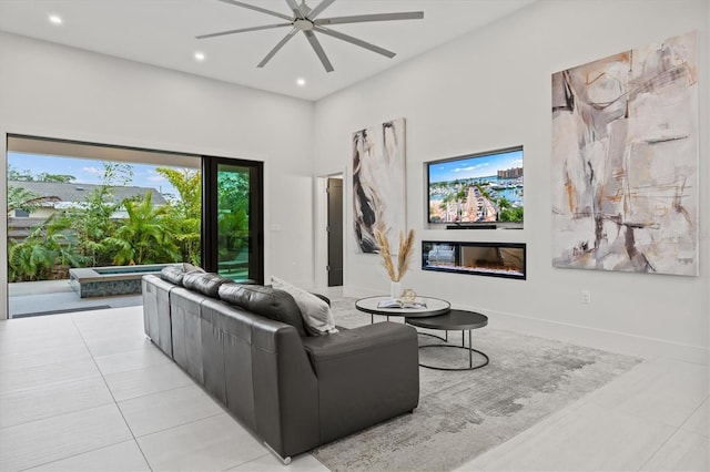 tiled living room with ceiling fan