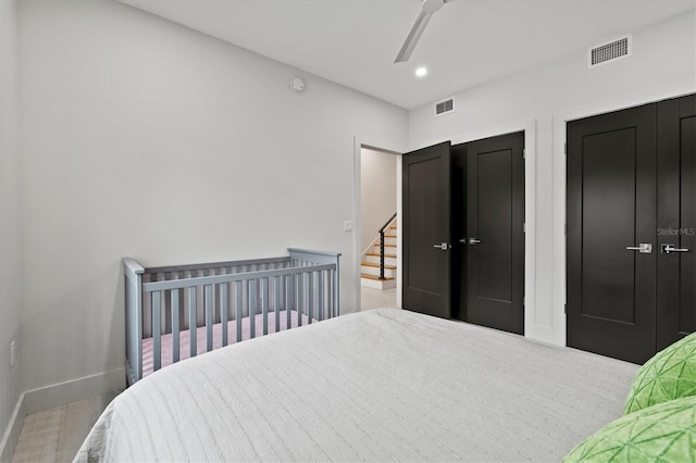 bedroom with ceiling fan and wood-type flooring