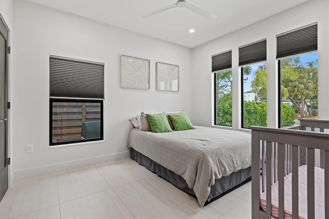 bedroom featuring ceiling fan and light tile patterned floors