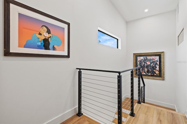 stairs with hardwood / wood-style flooring