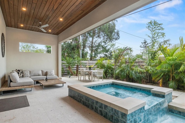 view of pool with ceiling fan, a patio area, outdoor lounge area, and an in ground hot tub