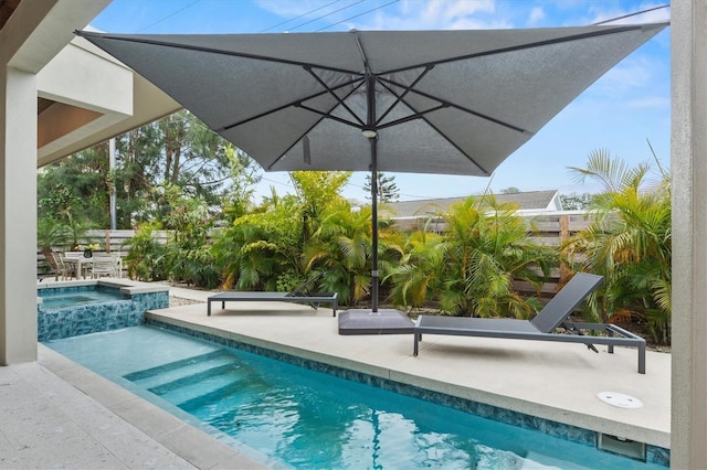 view of pool featuring an in ground hot tub and a patio area