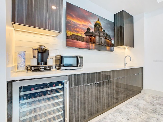 bar with sink and wine cooler