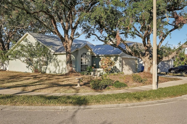 single story home featuring a garage