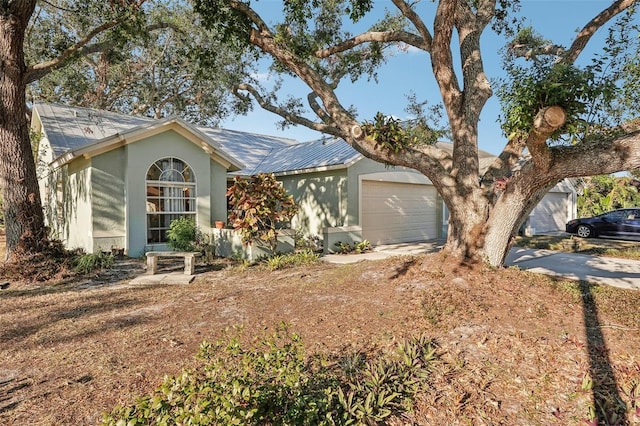 ranch-style home featuring a garage