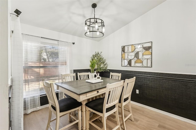 dining room featuring a chandelier and light hardwood / wood-style floors