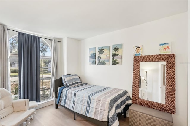 bedroom featuring multiple windows