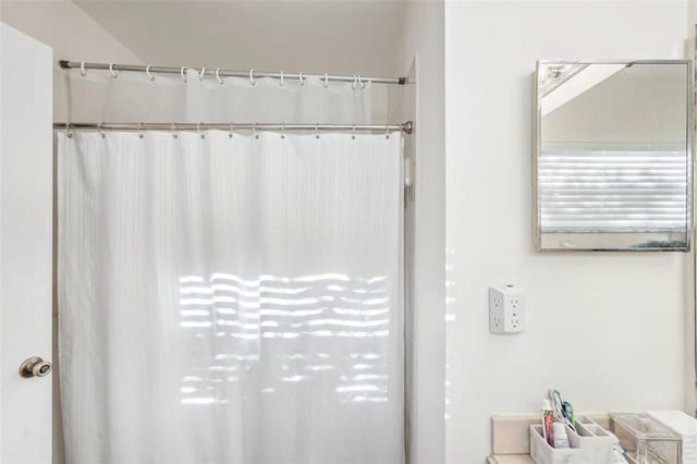 bathroom with curtained shower