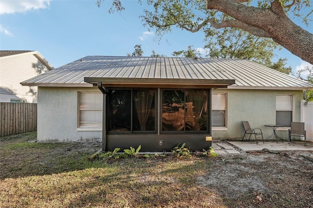 rear view of property with a patio area