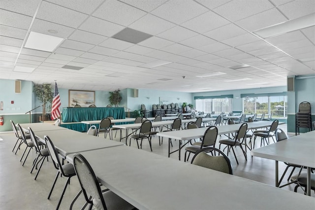 dining area featuring a paneled ceiling