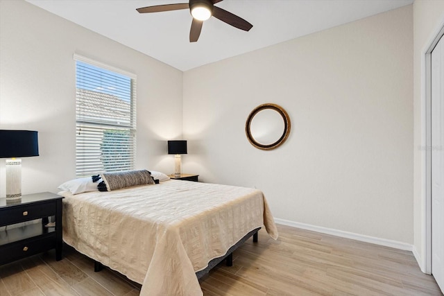 bedroom with light wood-type flooring and ceiling fan