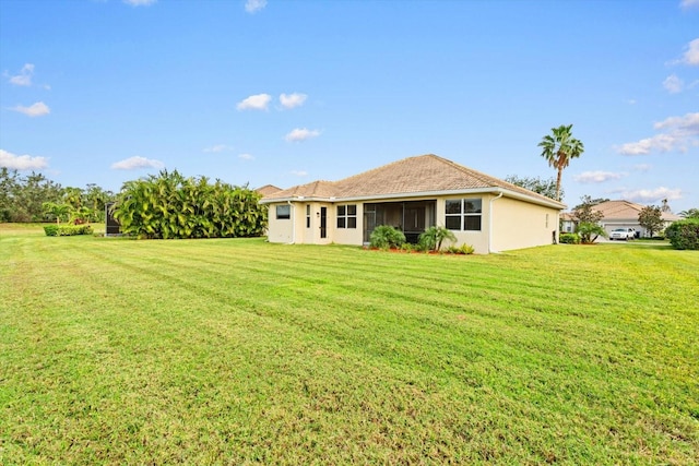 view of yard featuring a sunroom