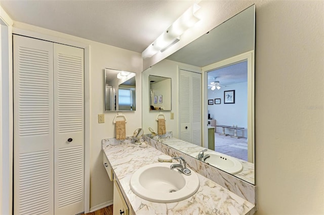 bathroom with vanity and ceiling fan