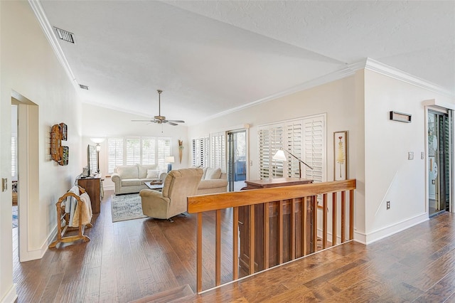 living room featuring ceiling fan, dark hardwood / wood-style flooring, lofted ceiling, and ornamental molding