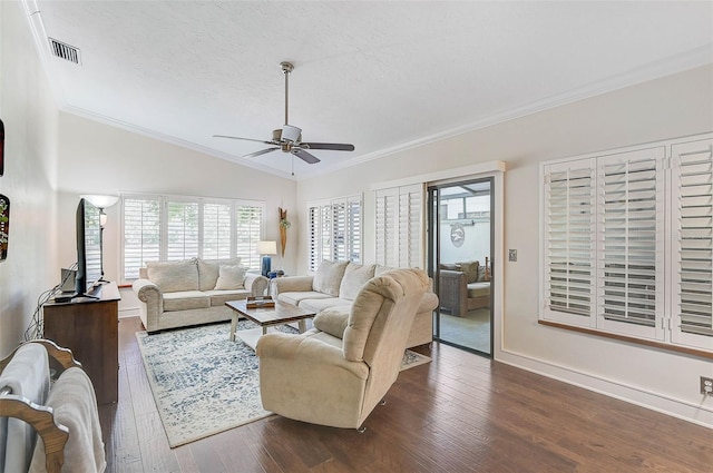 living room featuring lofted ceiling, dark hardwood / wood-style flooring, ceiling fan, and crown molding