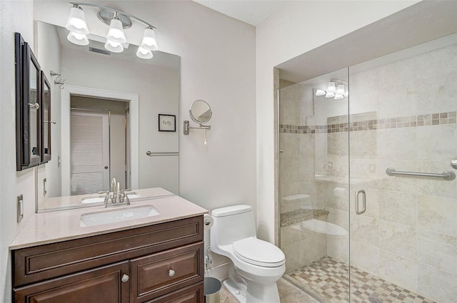 bathroom with vanity, toilet, and an enclosed shower