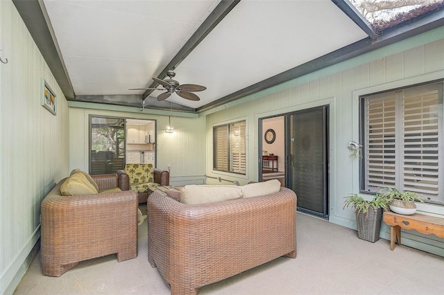 living room with vaulted ceiling with beams and ceiling fan