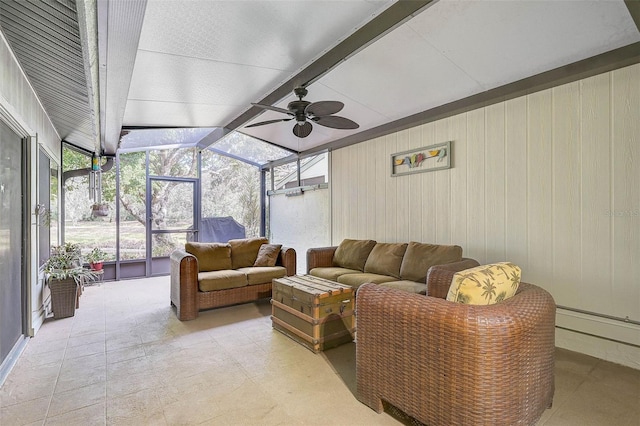 sunroom / solarium featuring vaulted ceiling with beams, ceiling fan, and plenty of natural light