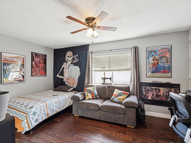 bedroom featuring a textured ceiling, ceiling fan, and hardwood / wood-style flooring