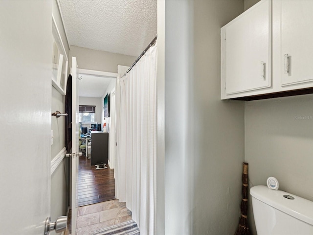 interior space featuring a textured ceiling