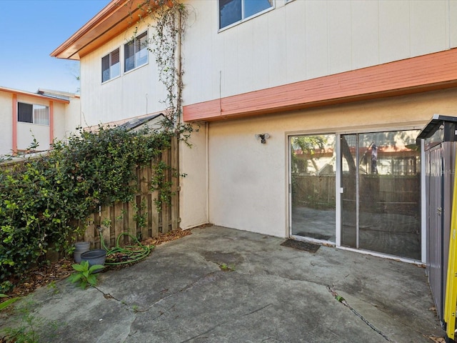 view of patio featuring fence