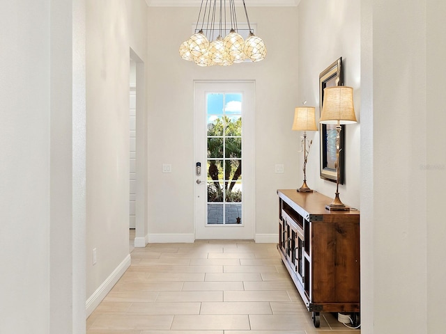 doorway to outside featuring a chandelier