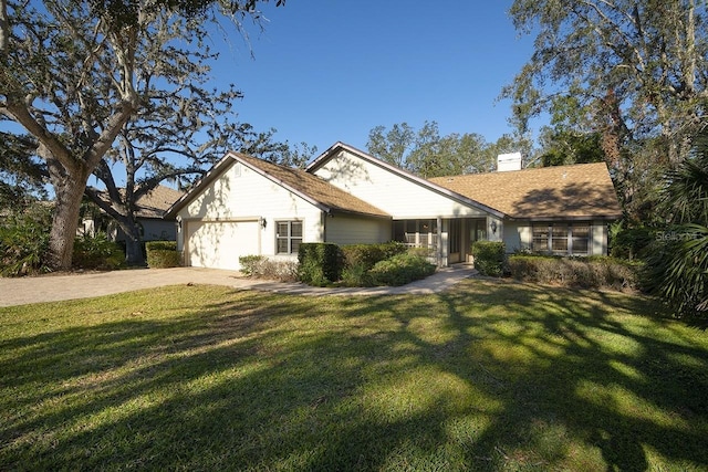 ranch-style home featuring a front yard and a garage