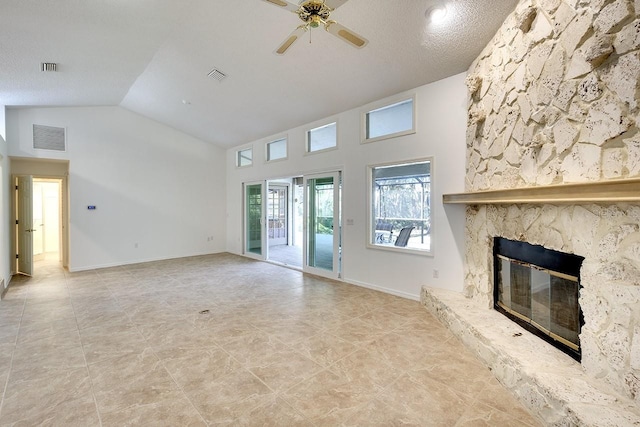 unfurnished living room featuring a textured ceiling, ceiling fan, a fireplace, and vaulted ceiling