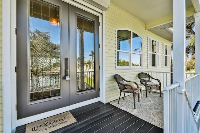 property entrance featuring a porch