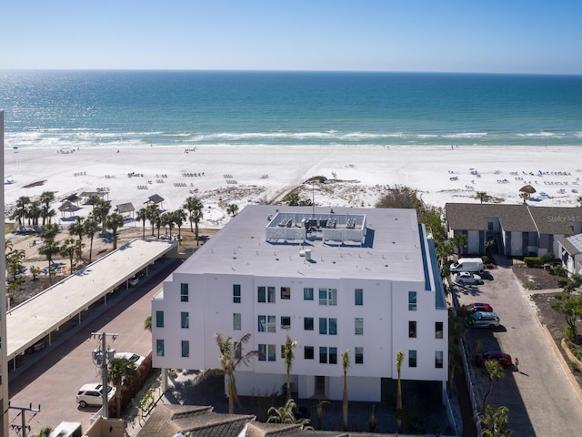 aerial view featuring a water view and a view of the beach