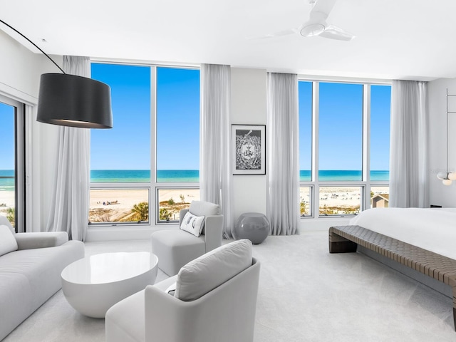 bedroom featuring carpet floors and a water view