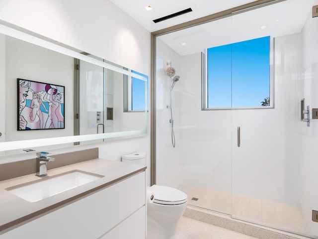 full bathroom with toilet, a shower stall, and vanity