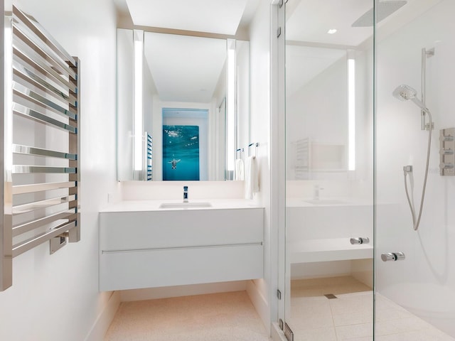 bathroom featuring a stall shower, vanity, and radiator heating unit