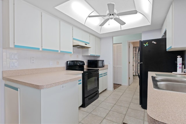 kitchen with ceiling fan, sink, black appliances, white cabinetry, and light tile patterned flooring