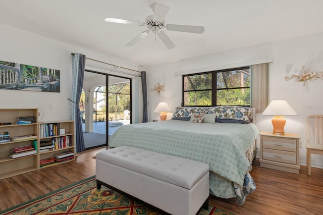 bedroom with ceiling fan, wood-type flooring, and access to outside