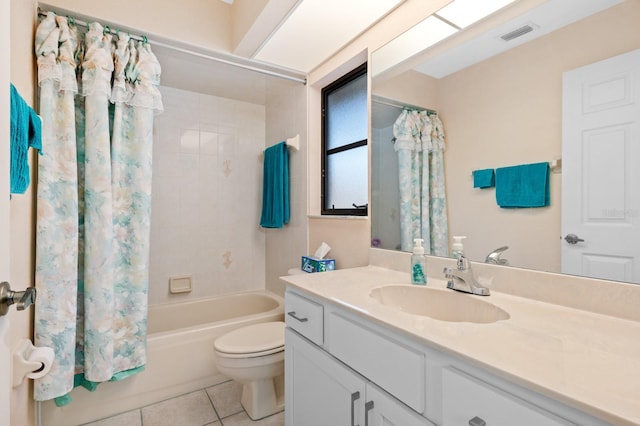 full bathroom featuring toilet, shower / bath combo, vanity, and tile patterned floors