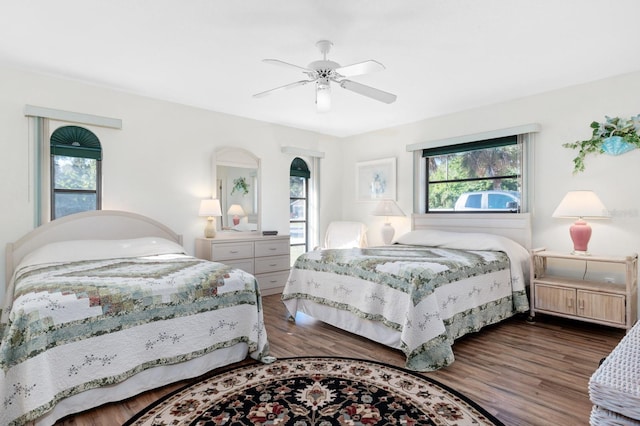 bedroom featuring ceiling fan and dark hardwood / wood-style floors