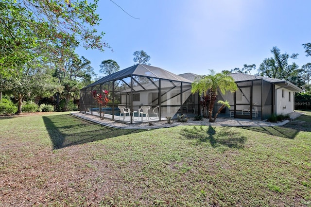 view of yard featuring a patio, a lanai, and a swimming pool