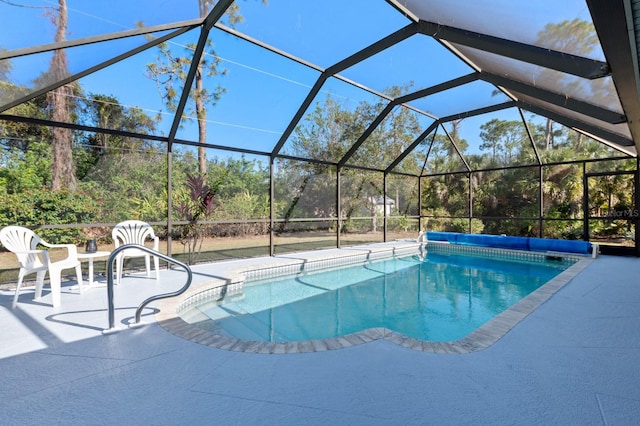 view of swimming pool with a lanai and a patio area