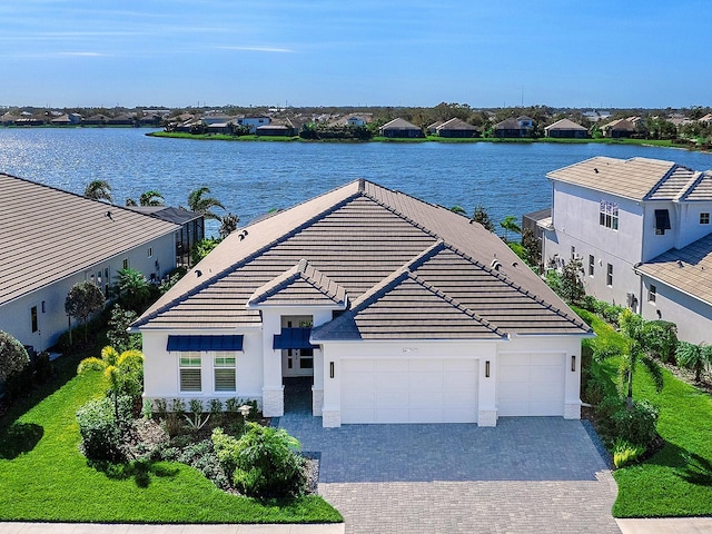 birds eye view of property featuring a water view